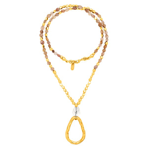 Cirene. Long golden and stone necklace.