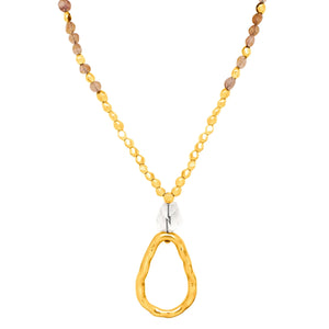 Cirene. Long golden and stone necklace.